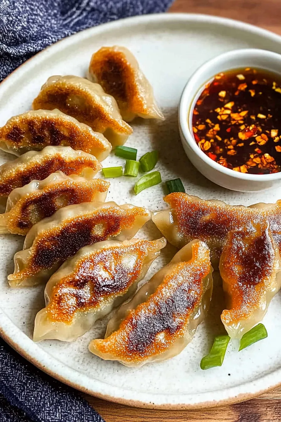 Plated Asian-style snack with a glossy soy-based sauce on the side