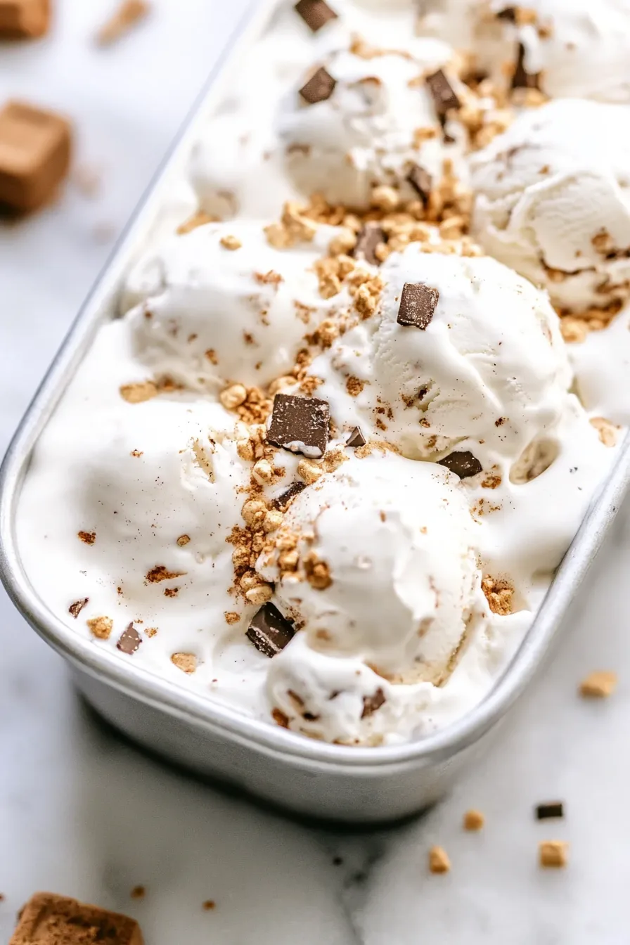 Dessert served in a bowl with melty chocolate and marshmallow swirls.