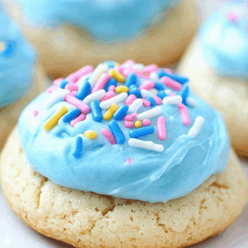 Soft, bakery-style treats in a variety of icing colors displayed on a platter