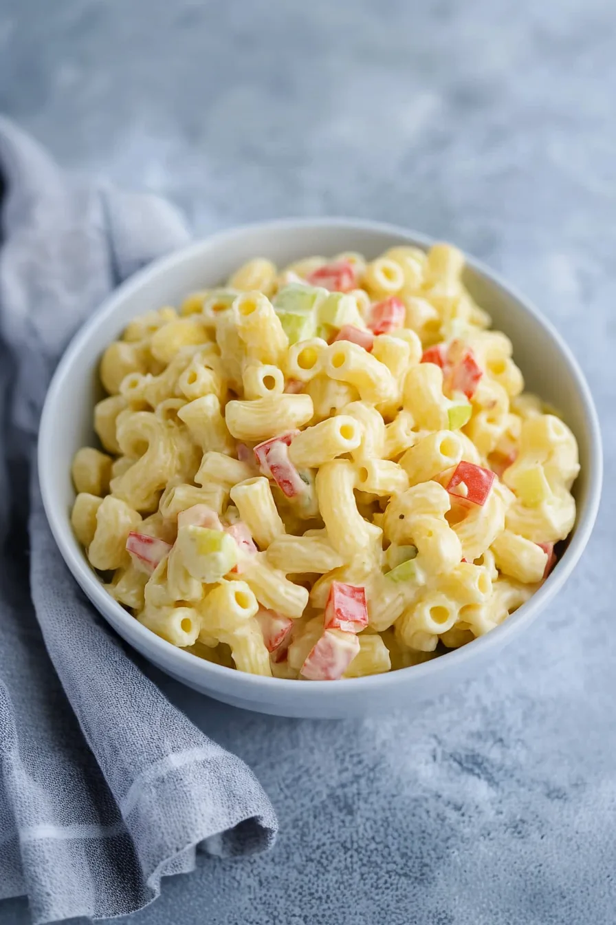 Overhead view of a chilled pasta salad in a large bowl