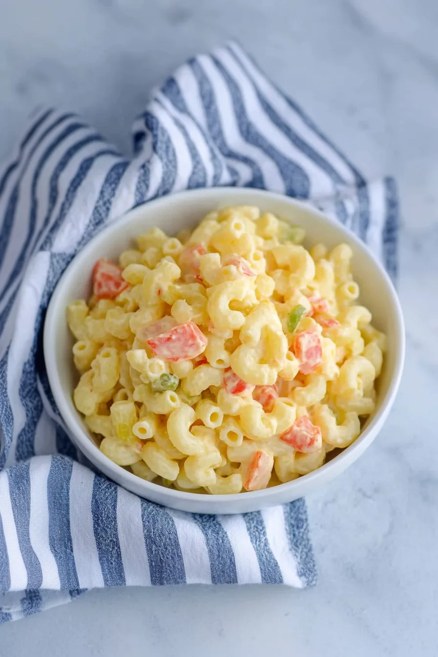 Bowl of creamy pasta salad with chopped vegetables