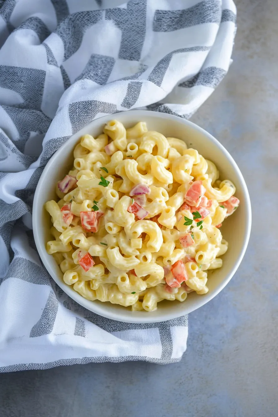 Plated portion of pasta salad with colorful vegetables