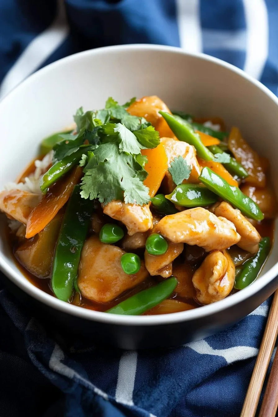Chinese chicken recipe served hot in a shallow bowl, ready to eat