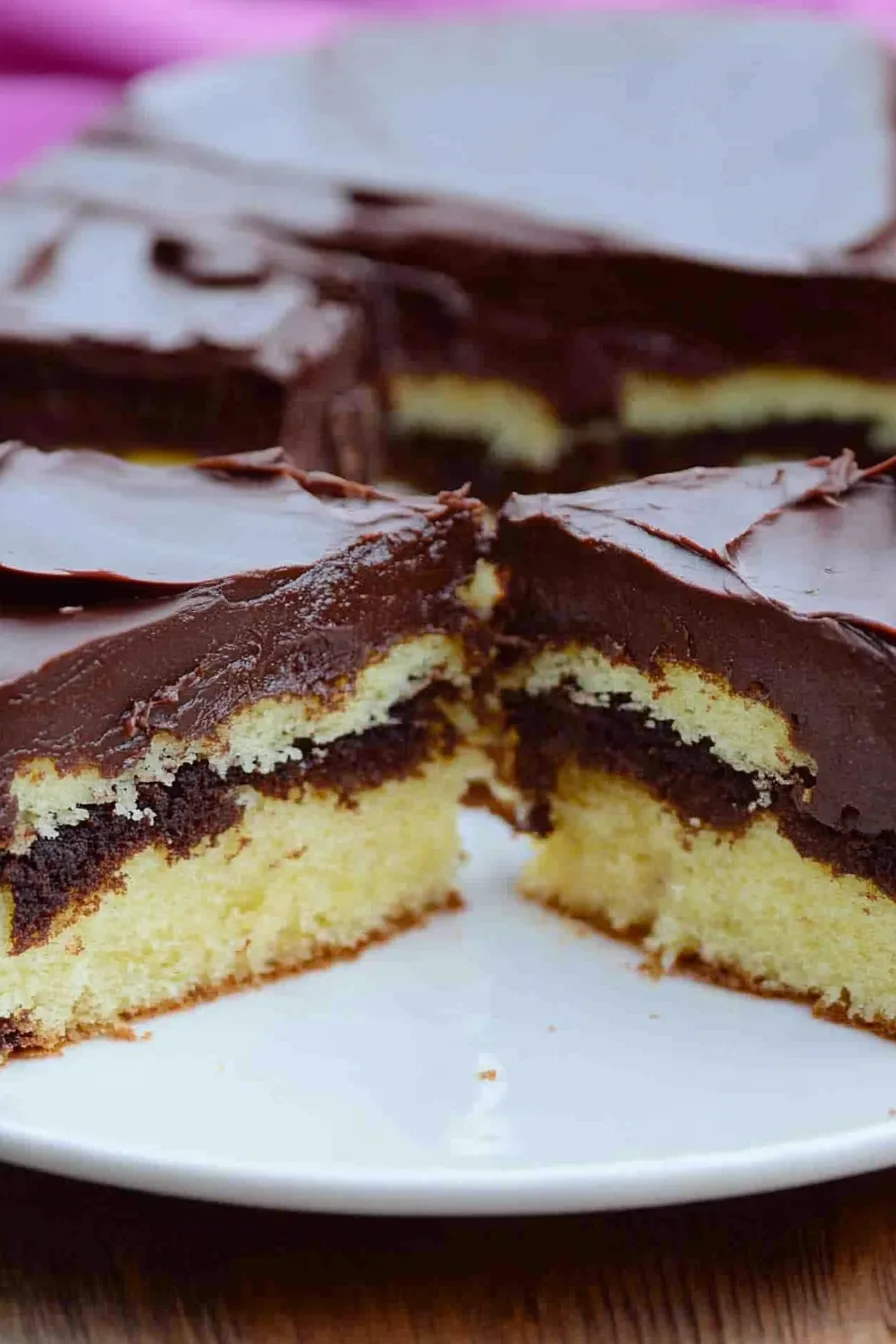 Golden-brown baked treats arranged on a white serving plate