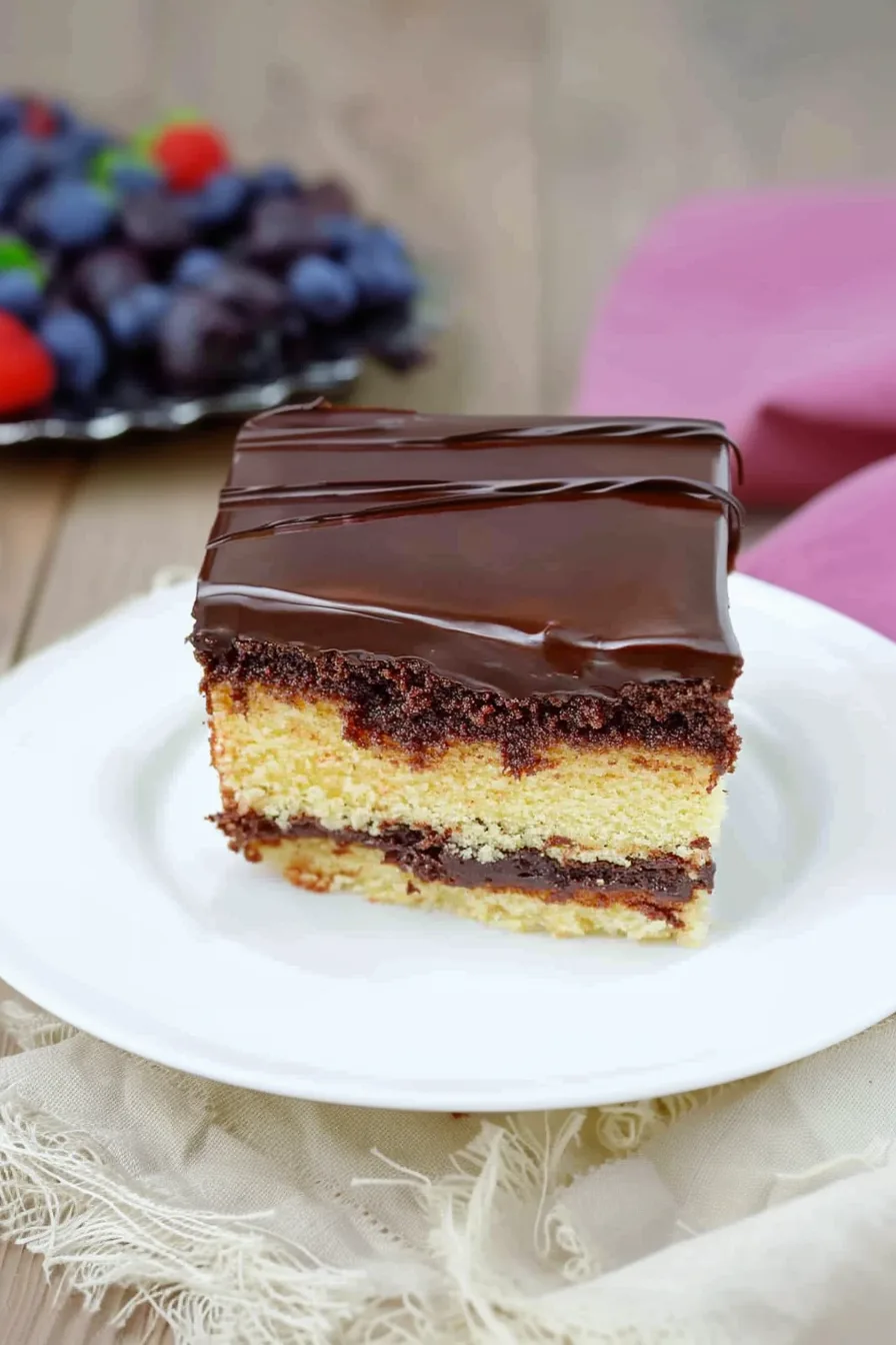 Neatly cut dessert squares dusted with powdered sugar