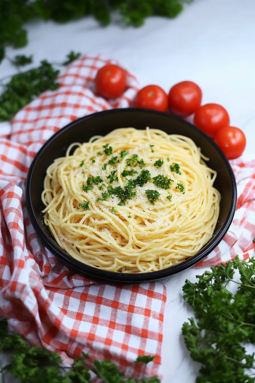 Creamy pasta served with a sprinkle of black pepper and parsley.