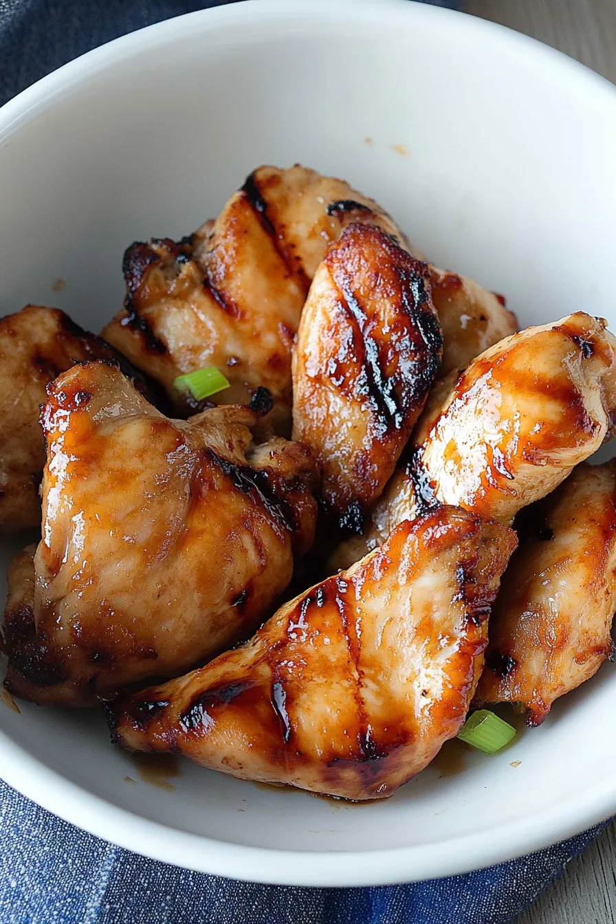 Close-up of tender chicken served with a glossy, sweet-savory glaze