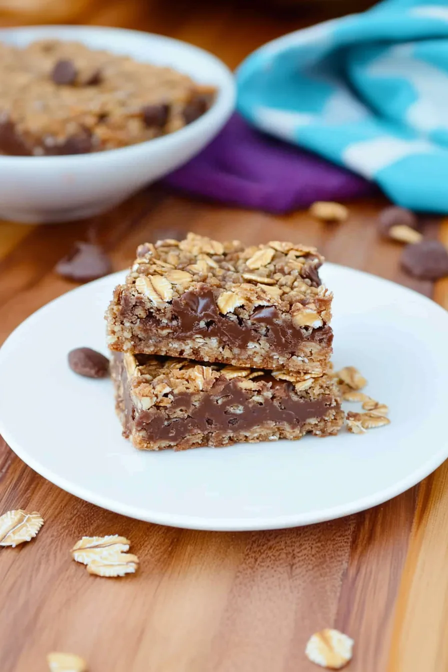 Golden brown treats on a serving platter with crumbs scattered around
