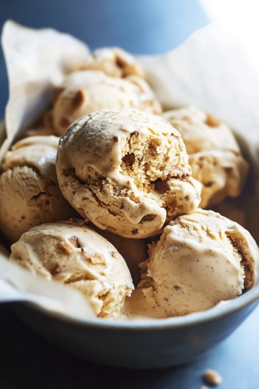Overhead shot of a bowl of ice cream with crunchy bits on top