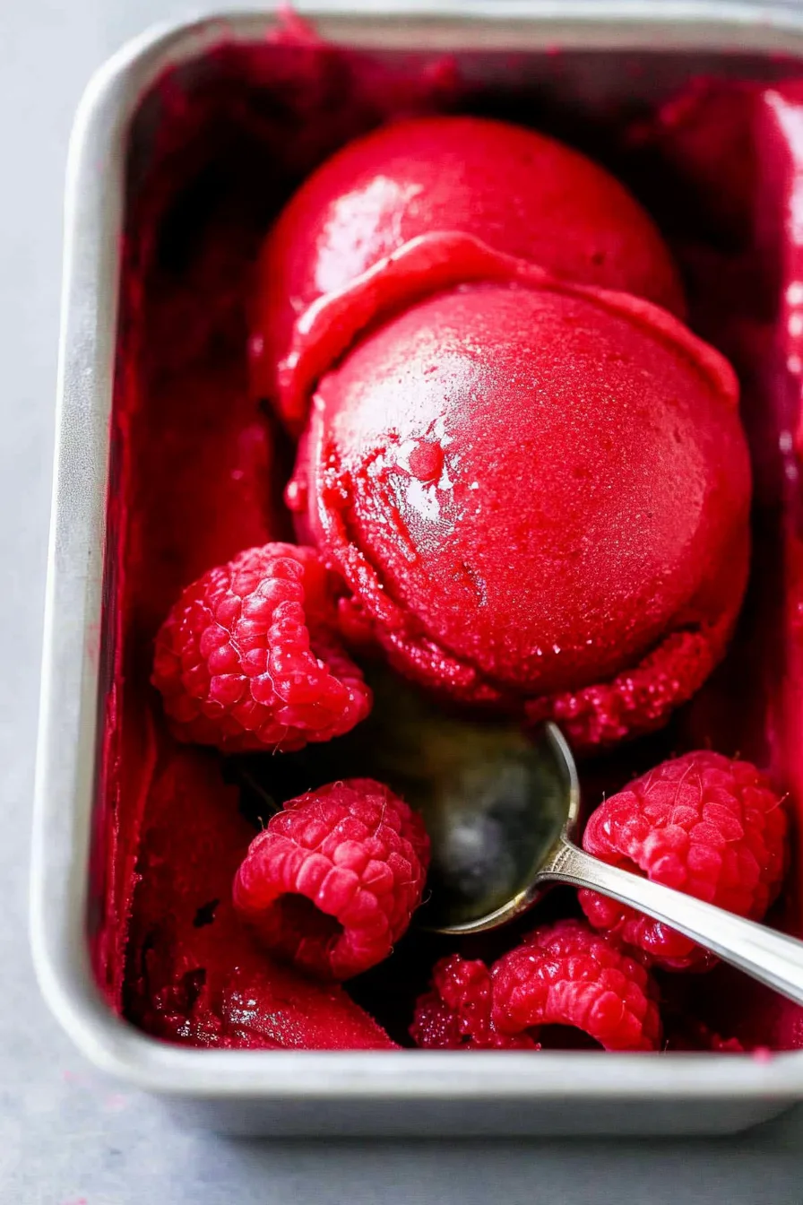 Close-up of a smooth, icy treat melting slightly in a glass dish.