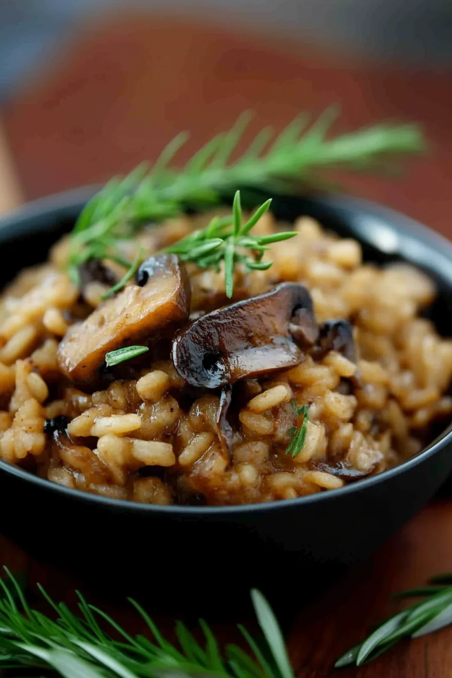 Overhead view of a warm, hearty dish with visible mushroom slices and creamy texture