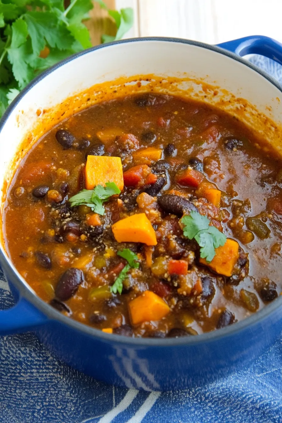 Close-up of chili topped with fresh herbs.