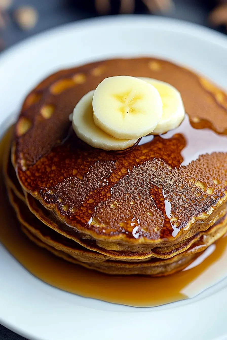 Close-up of spiced pancakes topped with butter and maple syrup