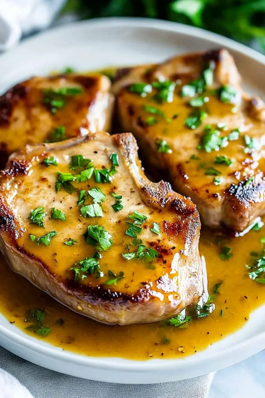 Plated pork chops with a sweet and tangy glaze
