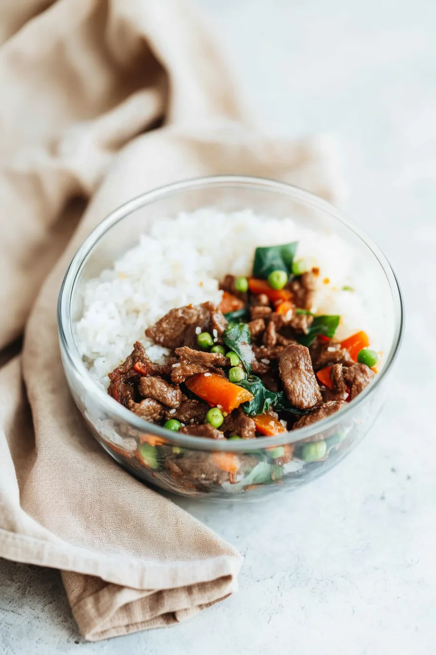 Hearty beef dish garnished with sesame seeds and scallions.