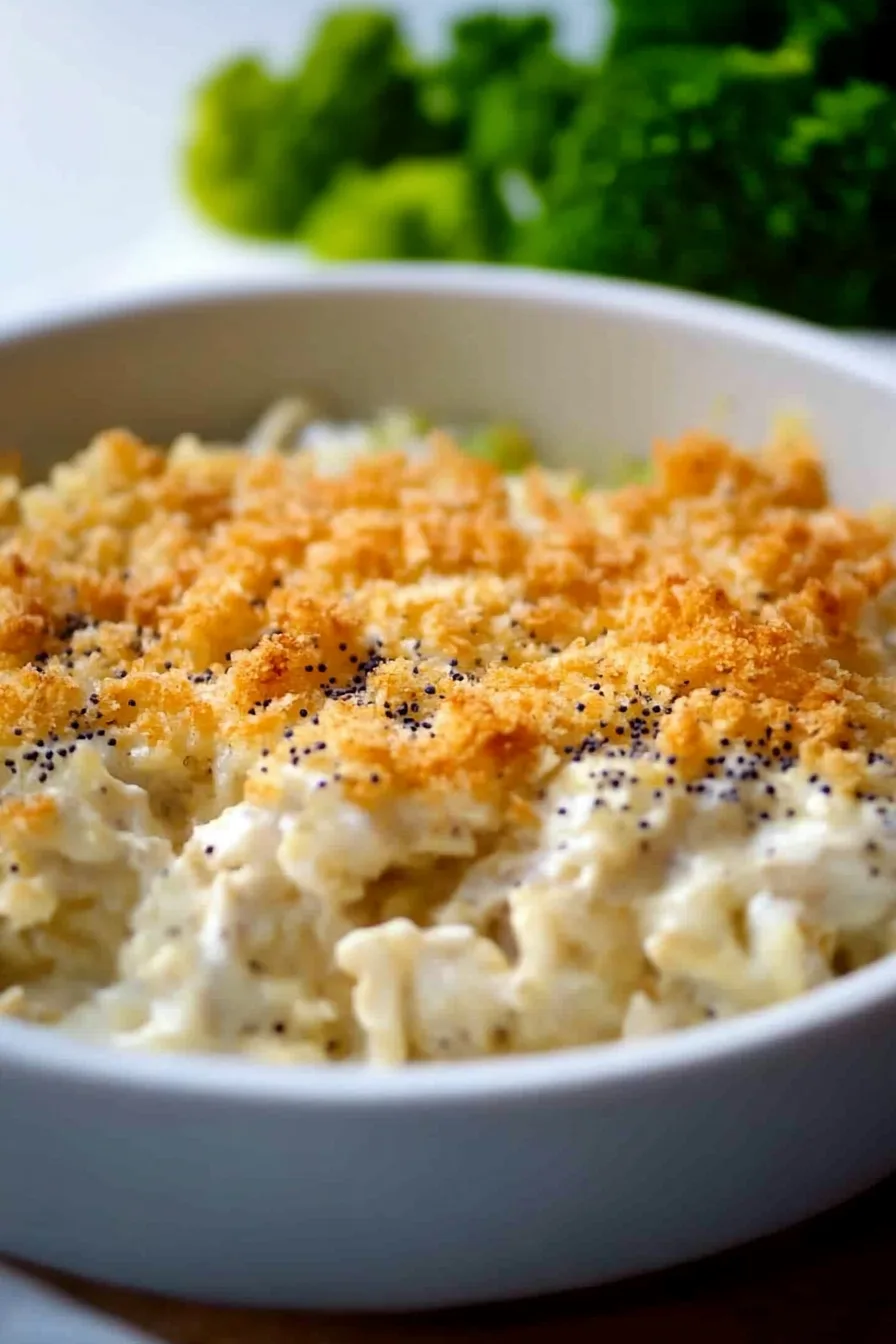 Close-up of a creamy casserole with a crispy crust.