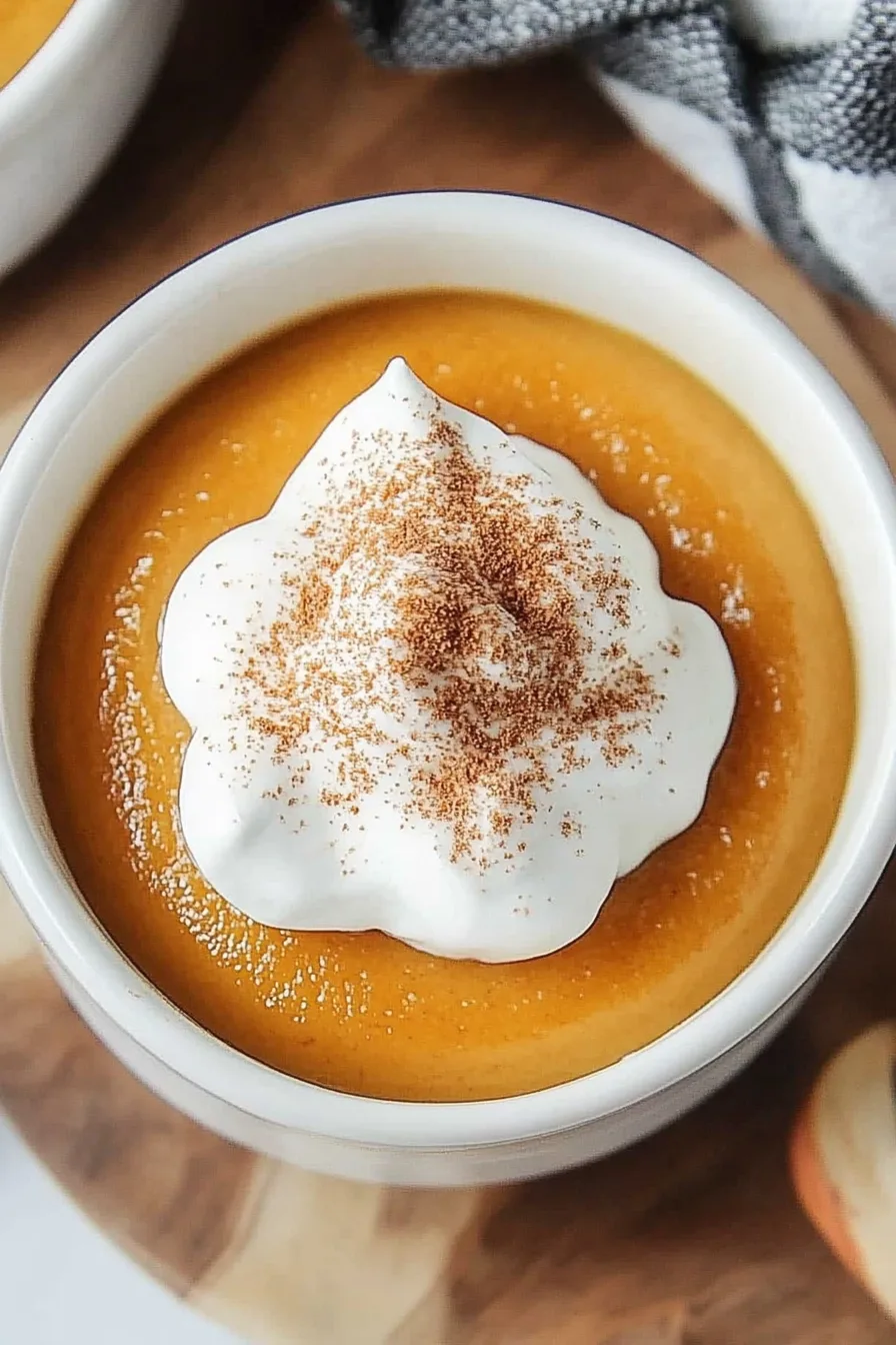 Close-up of a smooth baked custard with a golden-brown top