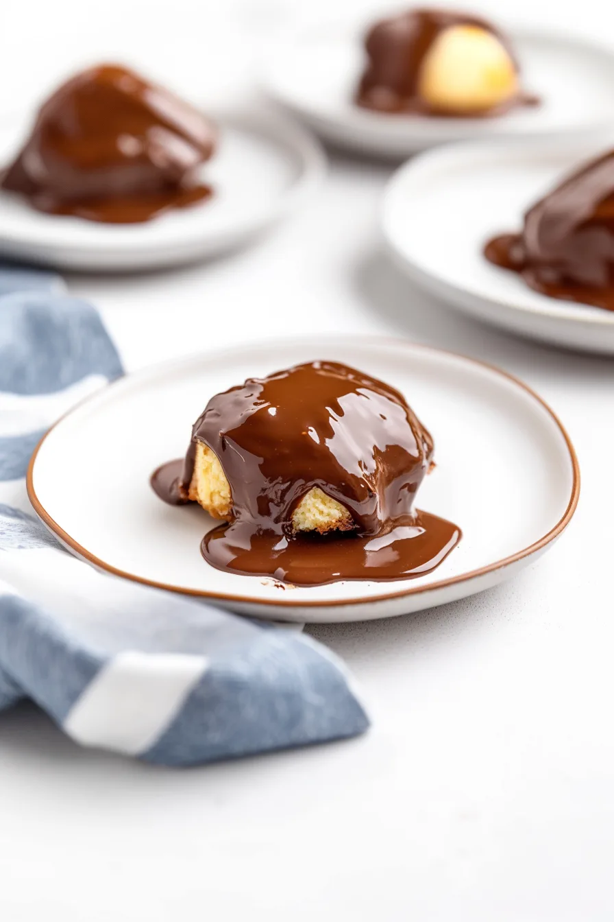 Rich homemade chocolate sauce draped over a freshly baked biscuit.