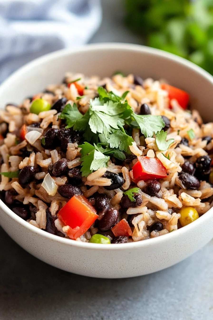 Warm, savory rice and beans garnished with fresh cilantro.