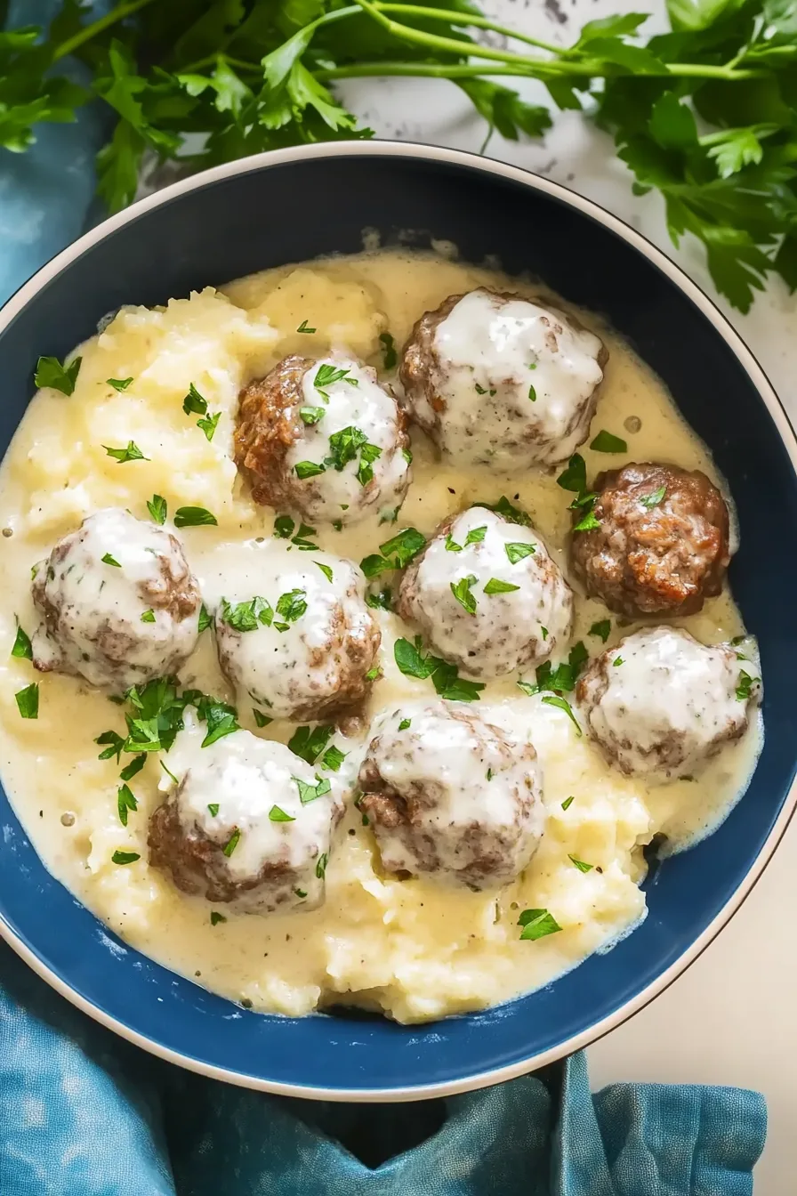 Creamy, hearty meatballs served in a light sauce with mashed potatoes on the side.