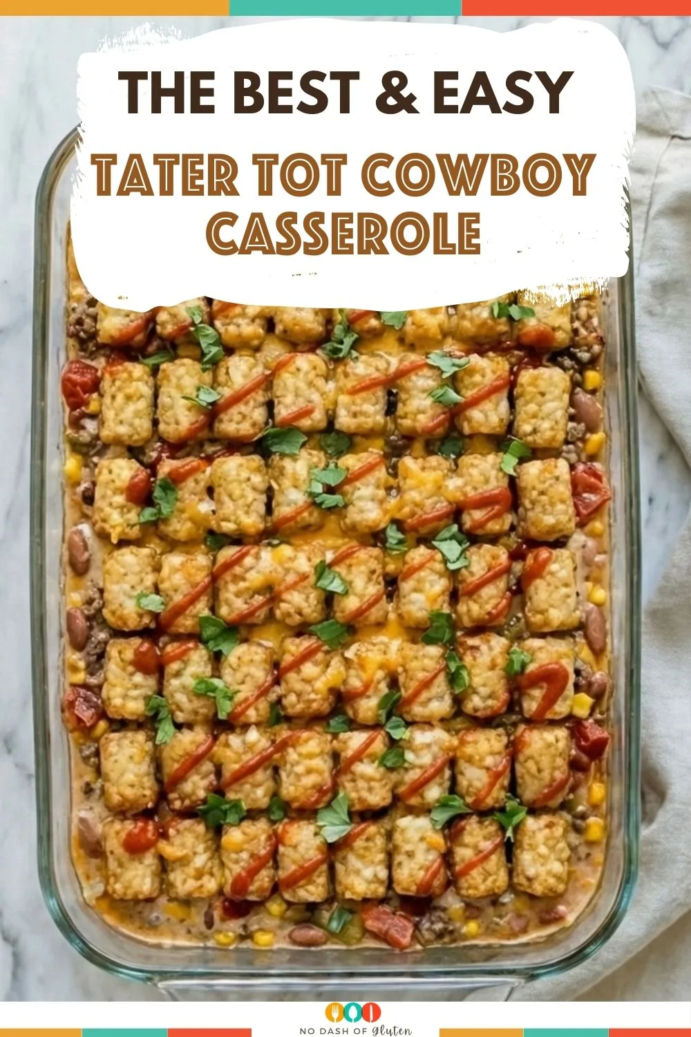 Tater Tot Cowboy Casserole topped with crispy tater tots melted cheese ground beef and herbs