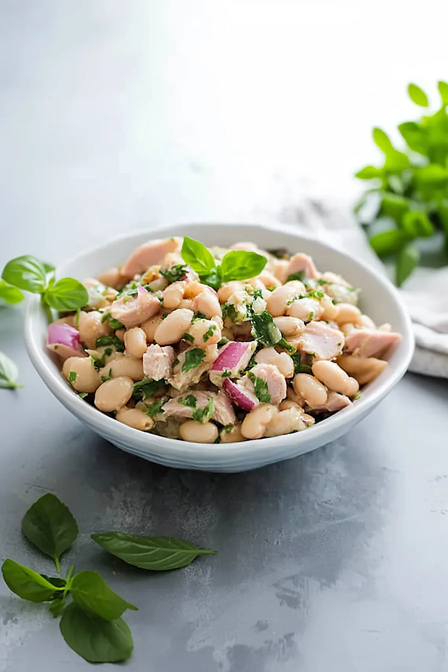Final presentation of a hearty, Mediterranean-style salad on a rustic table.