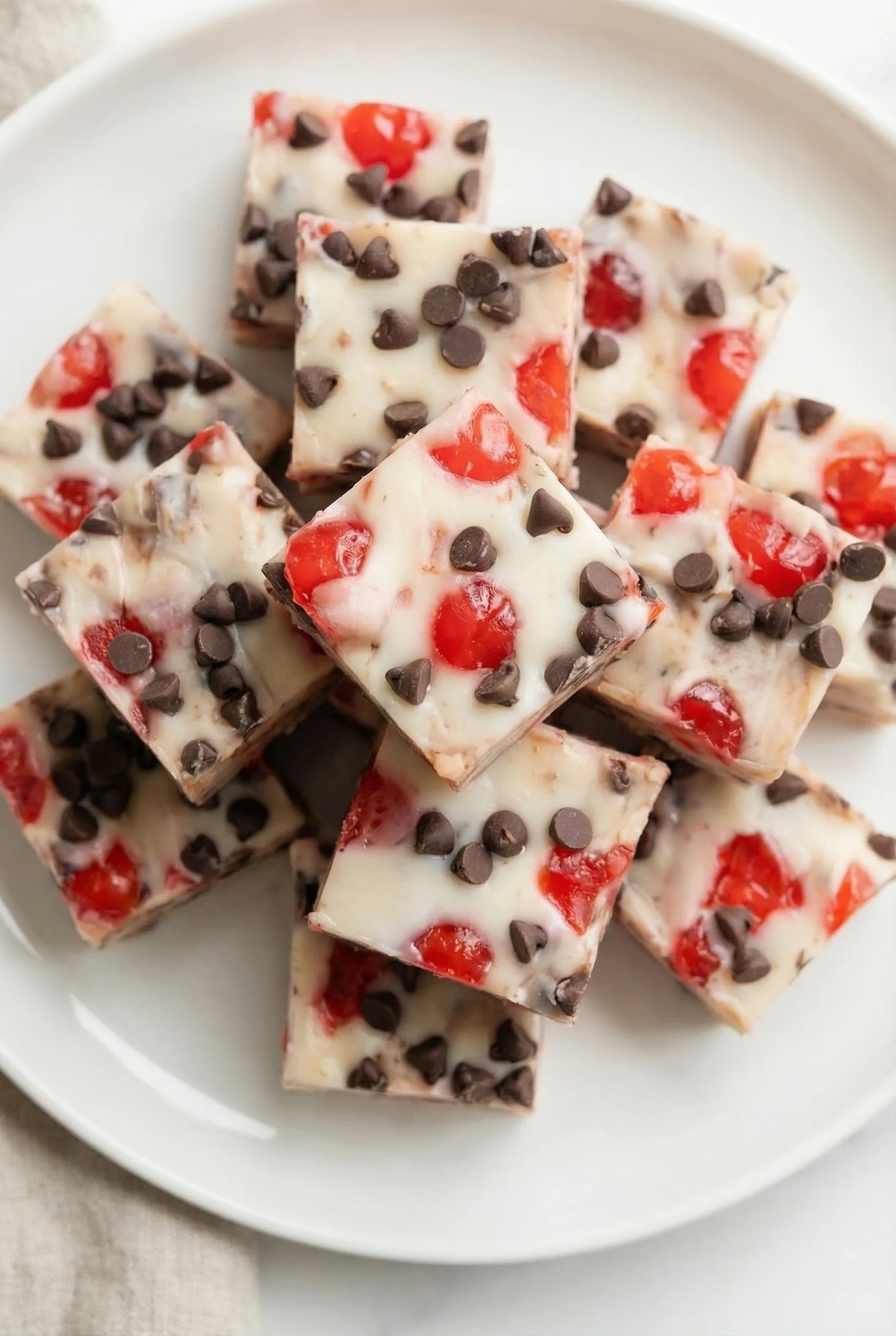 Final shot of Cherry Garcia fudge stacked neatly for serving, highlighting its creamy texture and mix-ins.
