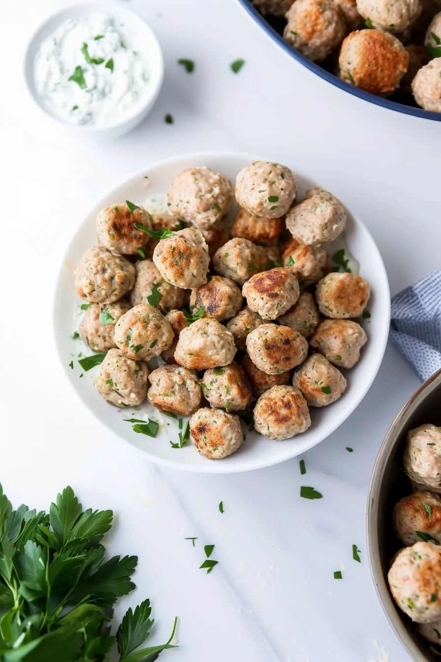 Plated turkey meatballs garnished with parsley, ready to serve.