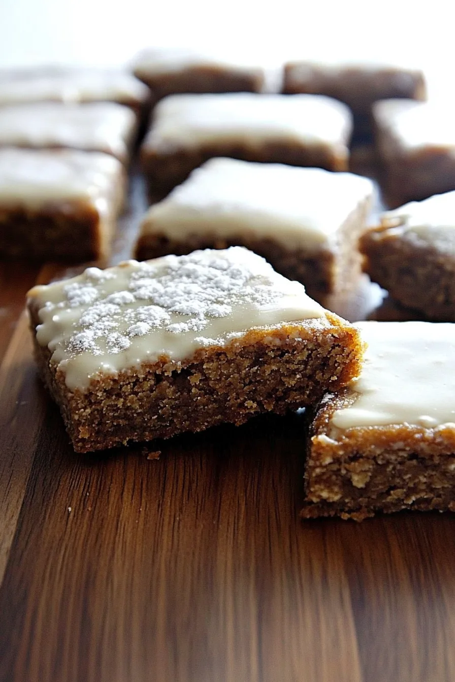 Freshly sliced bars with a shiny icing finish and warm brown color.