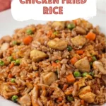 Chicken Fried Rice with tender chicken scrambled eggs peas carrots and flavorful seasoned rice