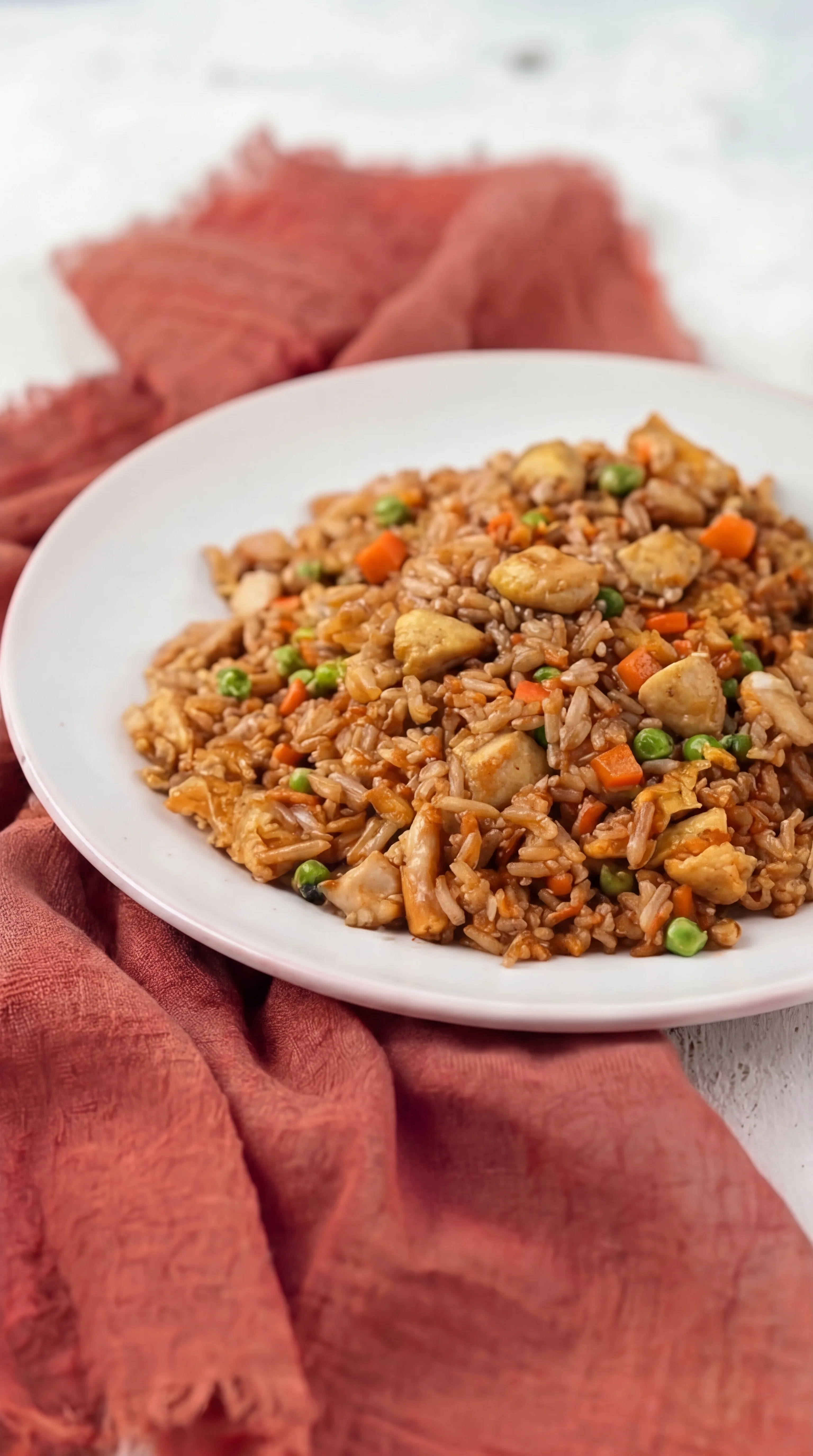 homemade fried rice with chicken vegetables scrambled eggs and savory sauce