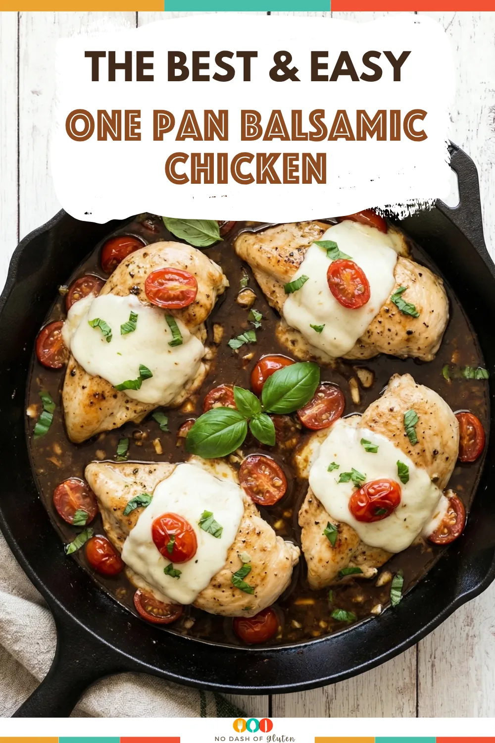 One Pan Balsamic Chicken in skillet topped with melted mozzarella cherry tomatoes and fresh basil
